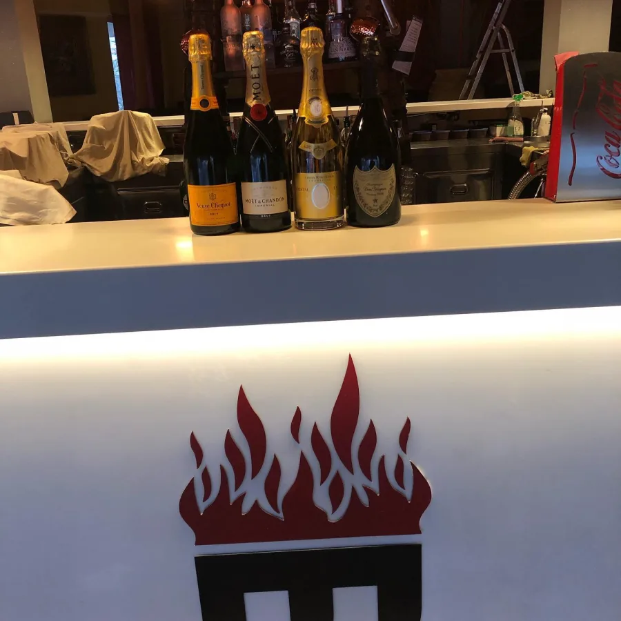 Maitai Club illuminated bar with its flame sign.