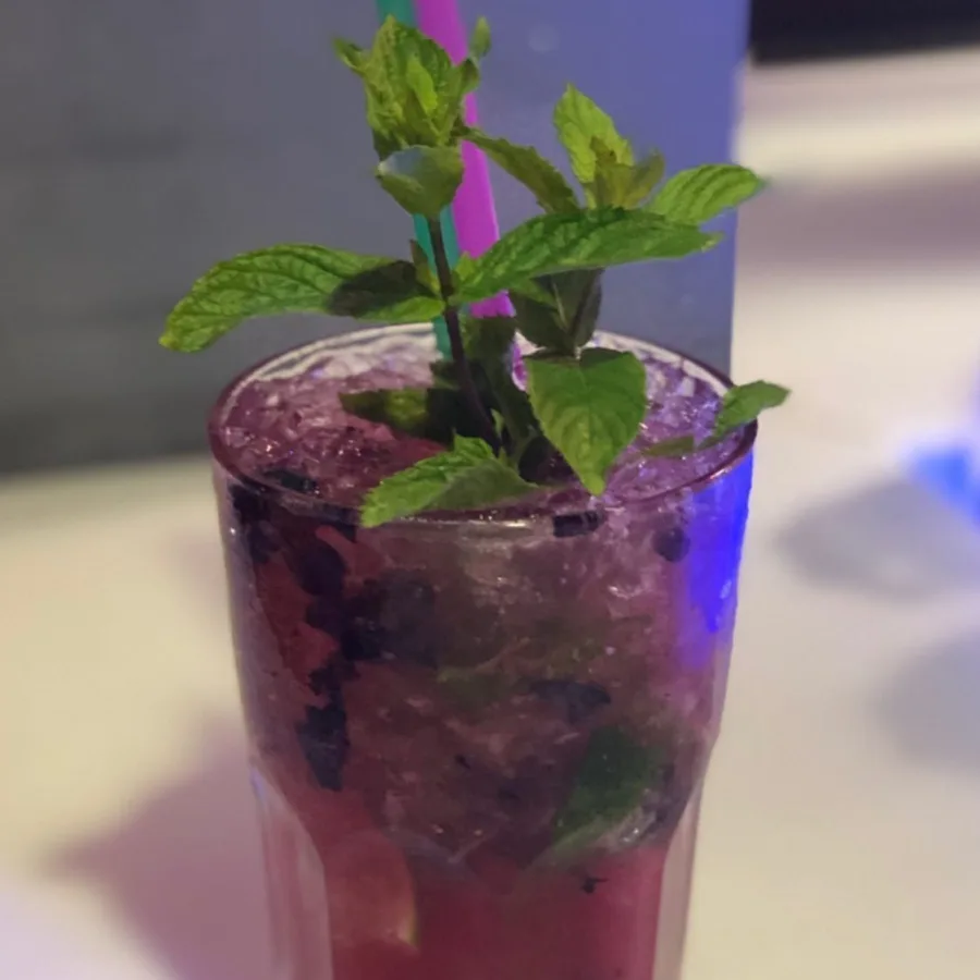 Purple cocktail with mint at Maitai Club.