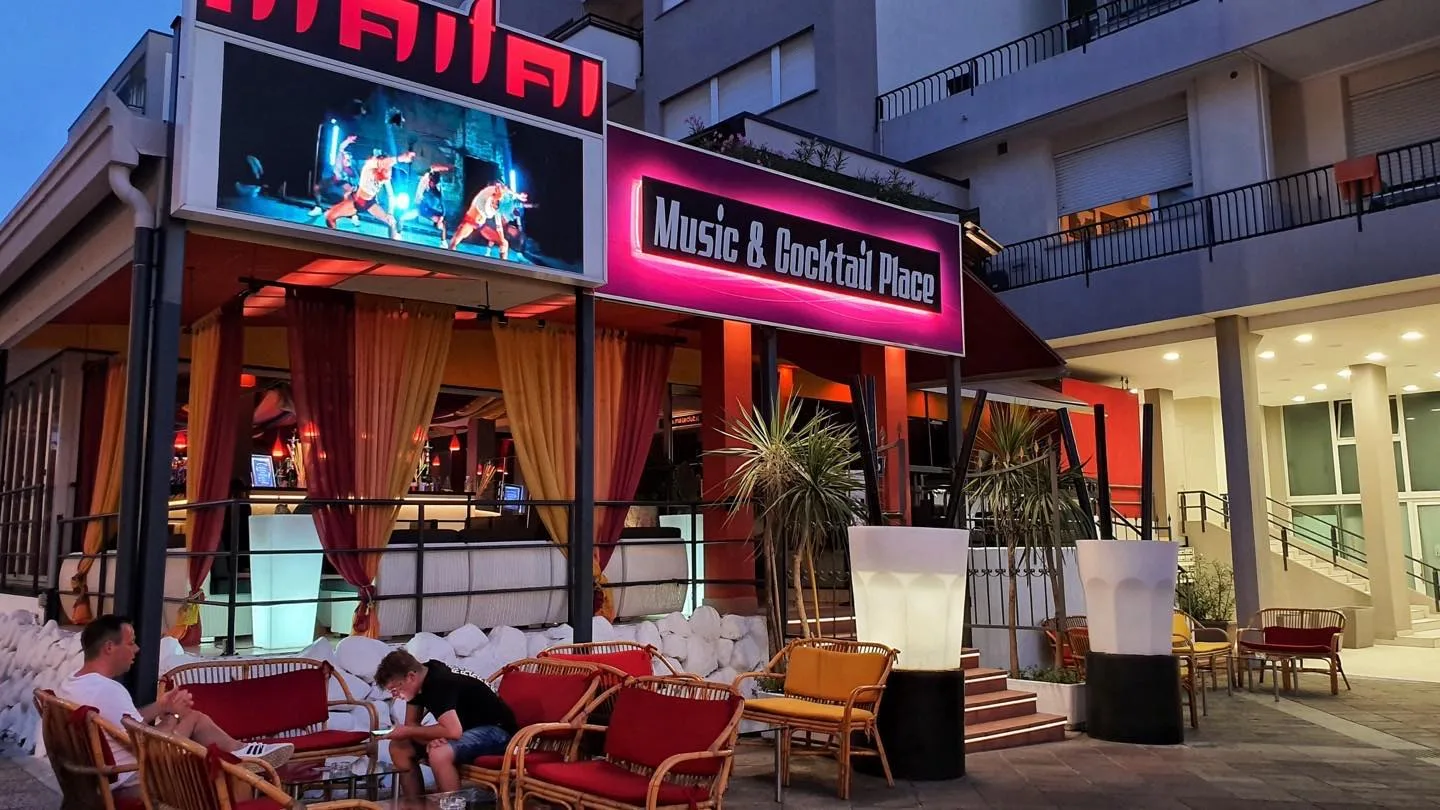 Maitai Club exterior in Piazza Marconi, Jesolo, at night.